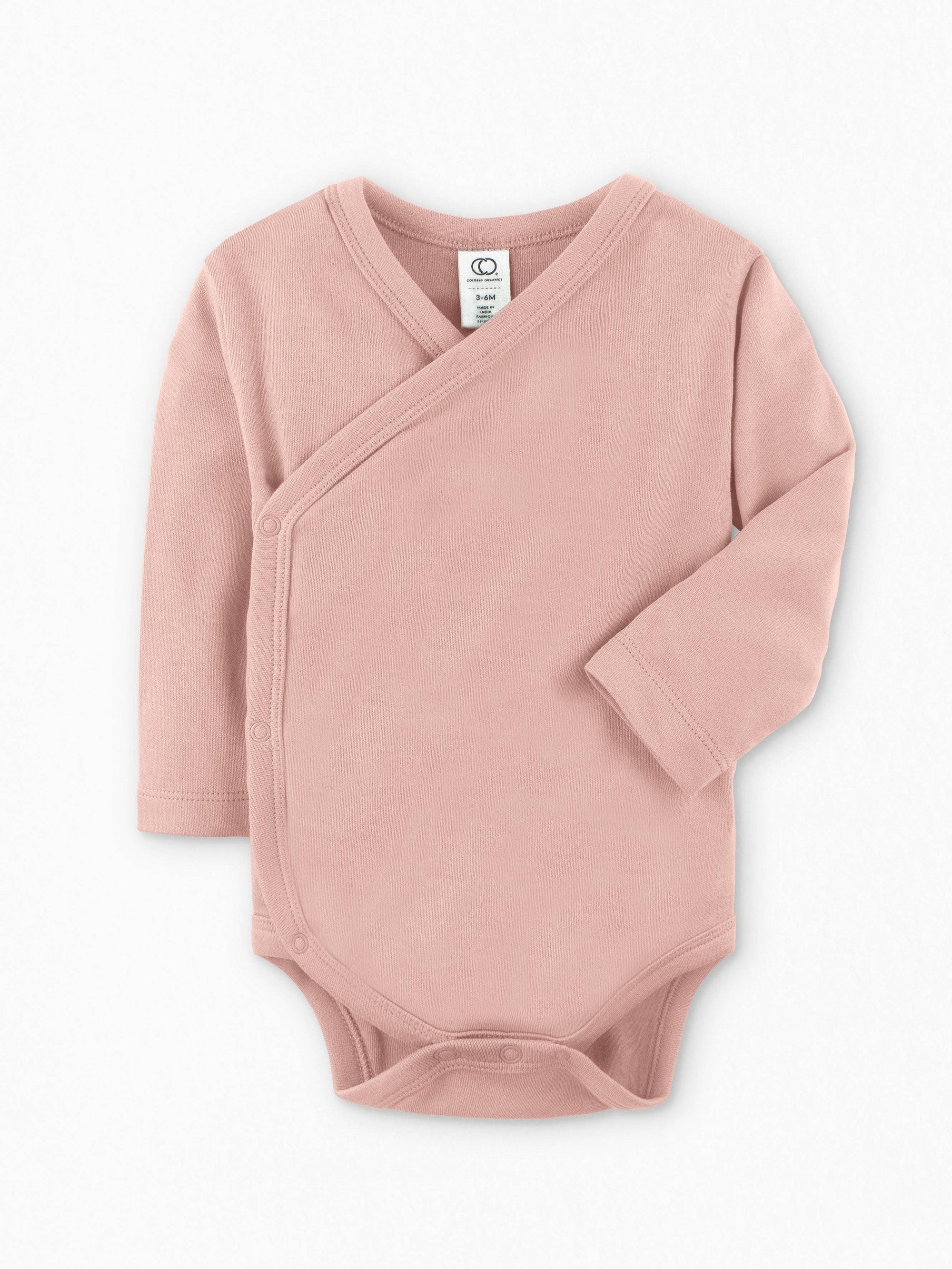 Pink baby wrap onesie on a white background