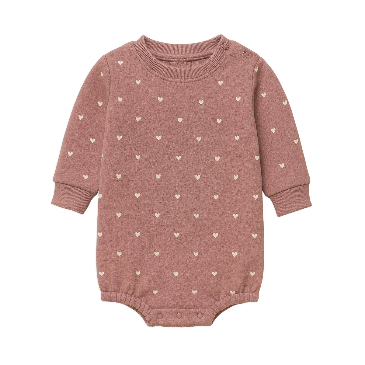 Pink baby romper with heart patterns on a white background